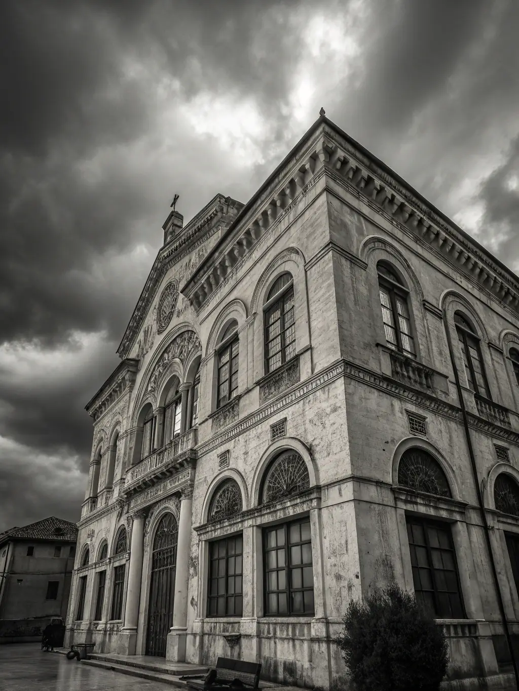 Photograph of a historic building in Trégor, illuminated during a cultural event, showcasing the integration of culture and architectural preservation.
